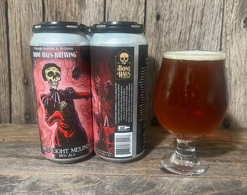 Image: Red Light Melinda is a sessionable red ale by Bone Haus Brewing. The can art created by Mikel Whelan shows Malinda Curtis pointing the way to the speakeasy.