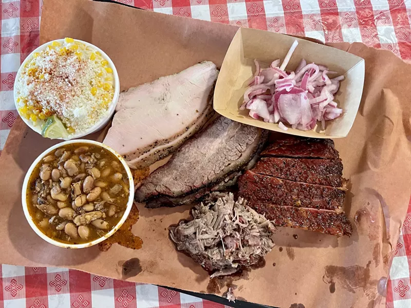 Image: A platter of meats and sides at Eric's Family BBQ.