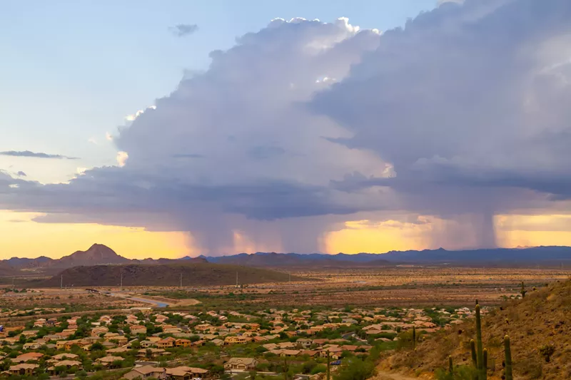 Image: A stock photo of a rainstorm in Arizona.