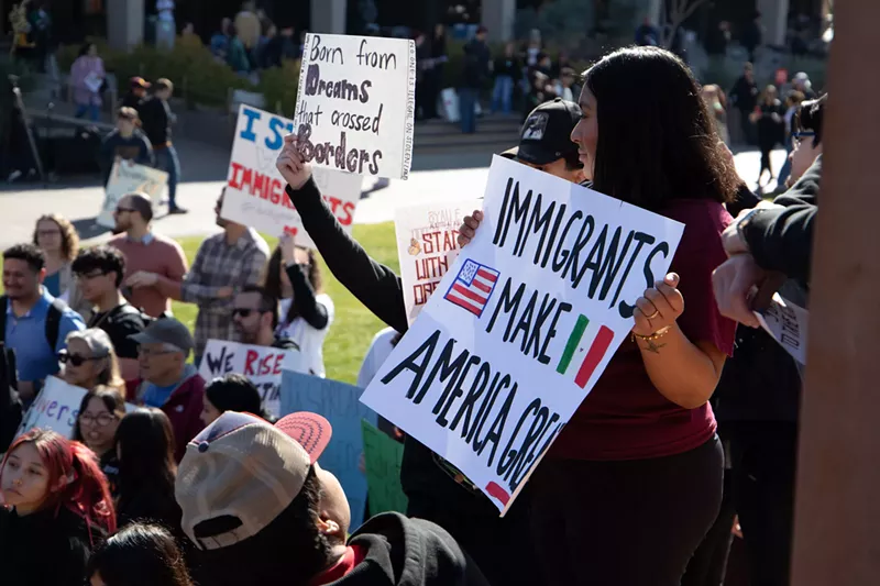Image: pro-immigrant protest signs