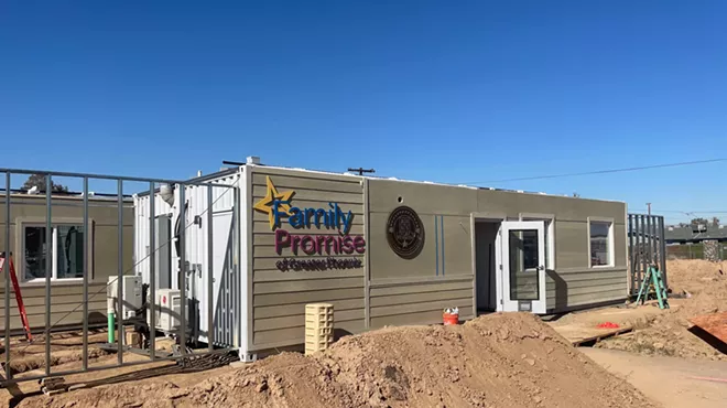 a shipping container retrofitted to be a dwelling