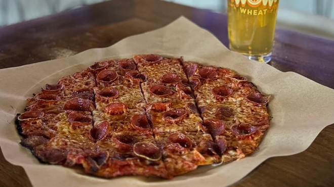 A personal pizza and pint of beer.