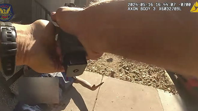 body-cam image of arms holding a gun