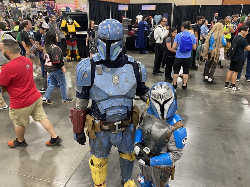 Mandalorian cosplayers in the Exhibitor Hall at Phoenix Fan Fusion 2023.