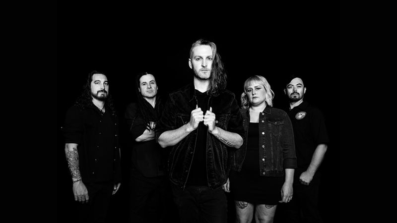 Image: A rock band in black and white.