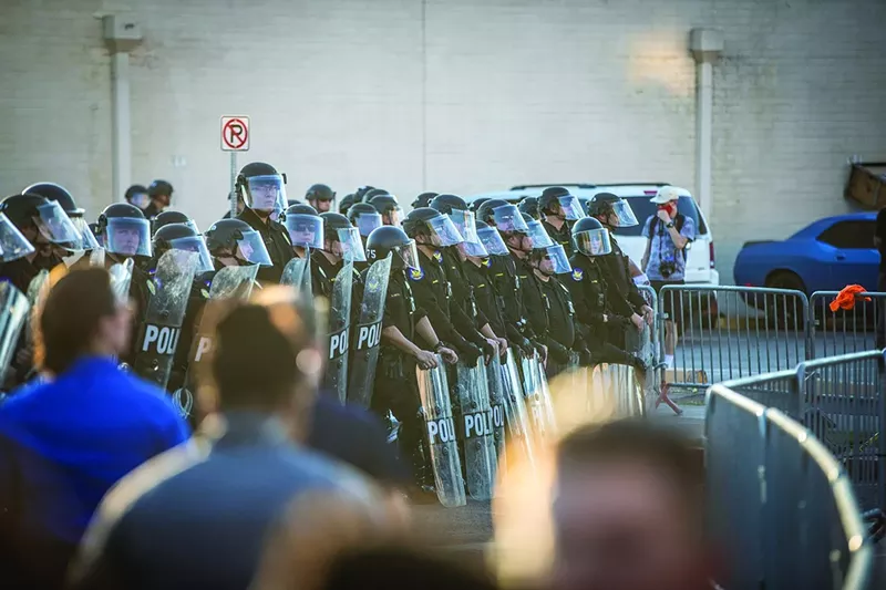 Image: Phoenix police officers, armed to the teeth, fired hundreds of rubber bullets and used tear gas canisters, batons, and pepper balls — which are more abrasive than pepper spray — against the protesters, court records show.