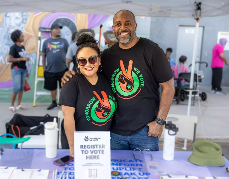 Image: Two people in matching T-shirts.