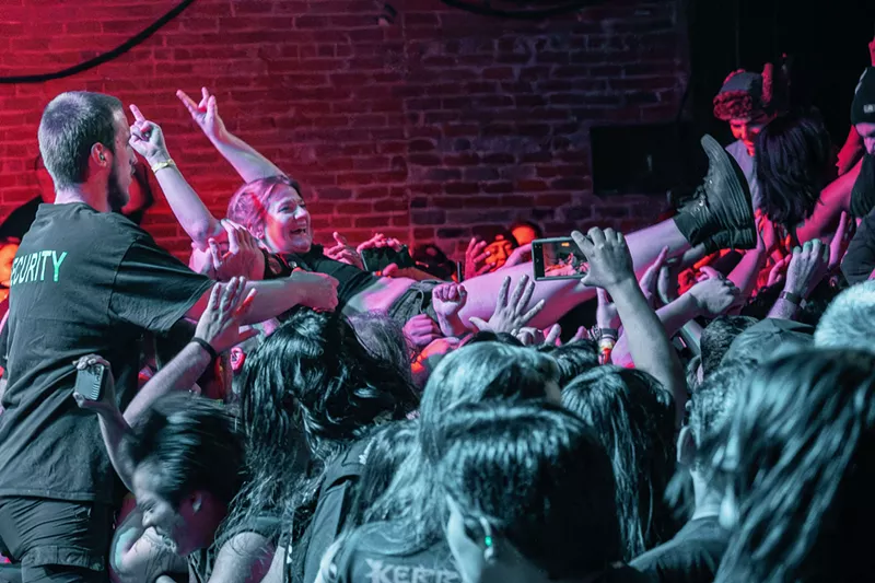 Image: A fan surfs atop the crowd during the Kerry King show on Feb. 19.