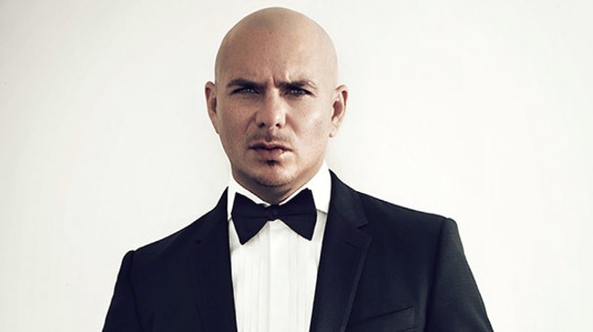 A man in a tuxedo against a white background.