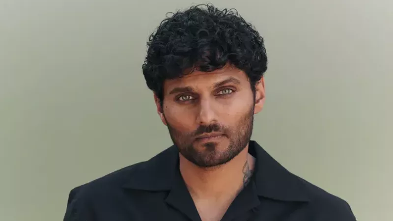 Image: A headshot of an Indian man.