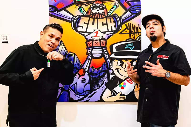 Image: Champ Styles, right, and his father, Such Styles, pose with a Champ piece inspired by Such.