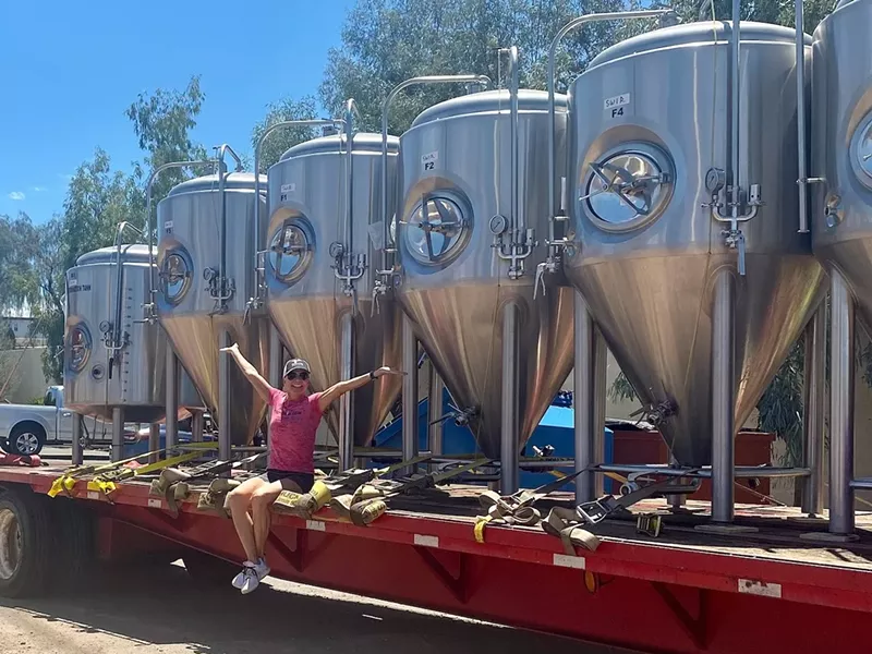 Image: Hundred Mile Brewing Company owner Sue Rigler rejoices over the arrival of the tanks for her 10-barrel brewhouse.