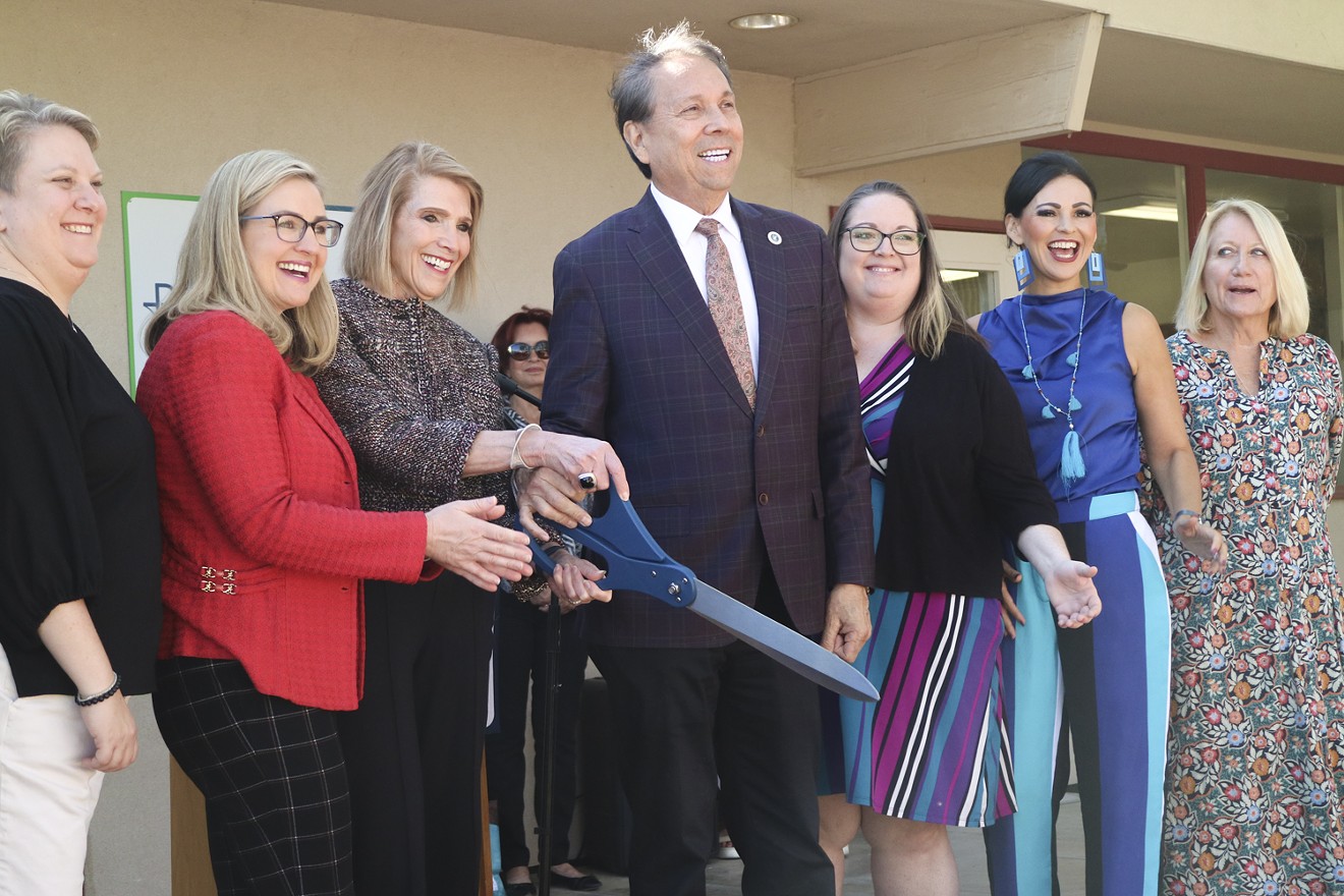 Phoenix Mayor Kate Gallego, Civia Tamarkin and Scottsdale Mayor David Ortega cut the ribbon on Ruth Place during the center's opening ceremony on Nov. 1.