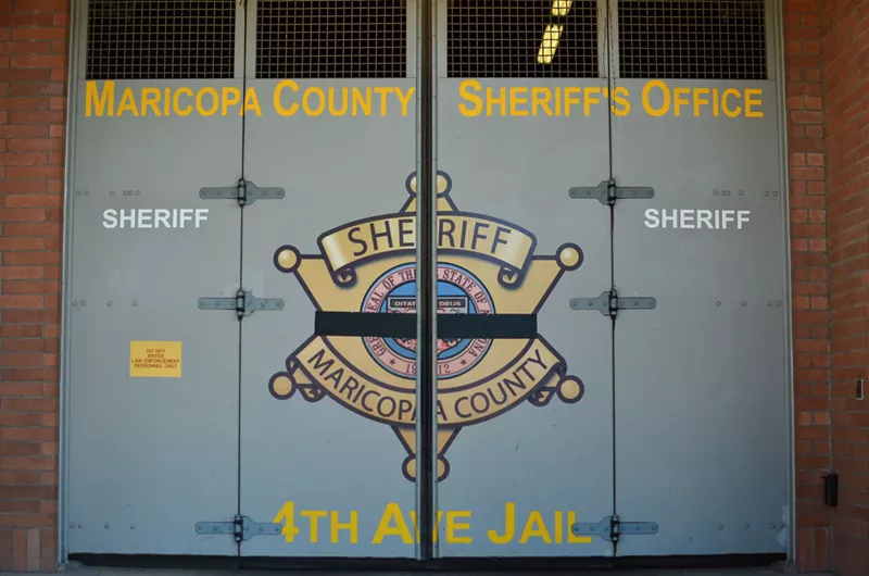 Image: a door at the 4th avenue jail with the maricopa county sheriff's office seal on it