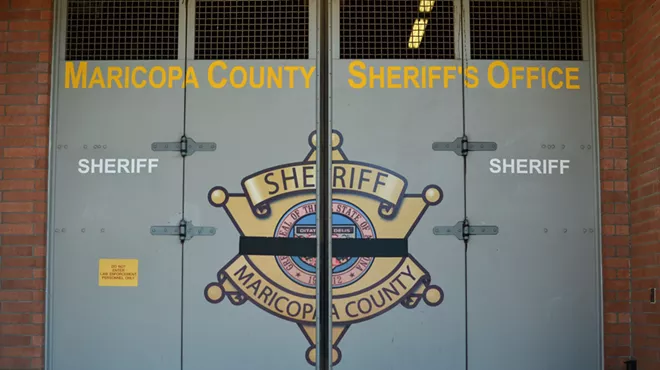 a door at the 4th avenue jail with the maricopa county sheriff's office seal on it
