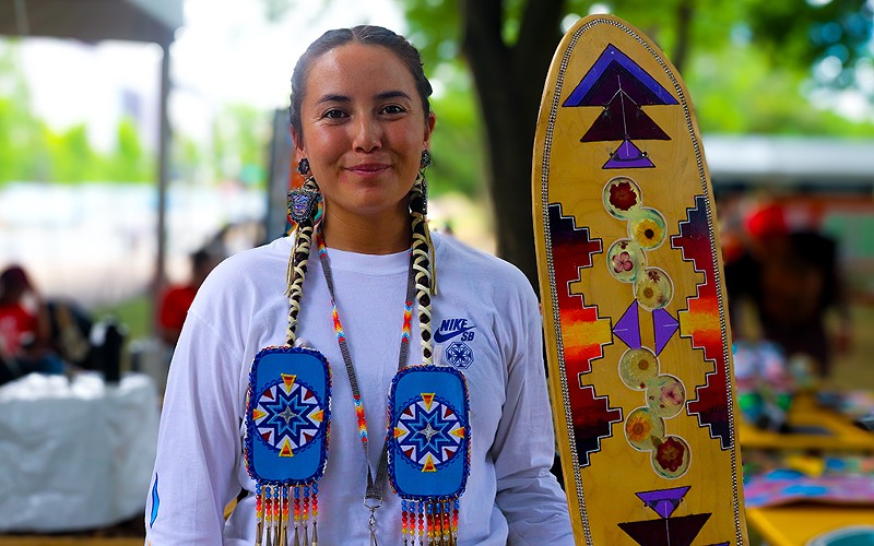 Di’Orr Greenwood with one of her handcrafted skateboards at the Smithsonian Folklife Festival in Washington, D.C.