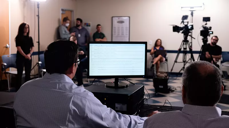 Image: Independent auditors display the winners from Arizona's social equity lottery on Friday.