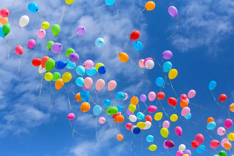 Image: a bunch of balloons in the sky