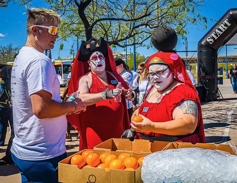 Image: Drag queens with oranges