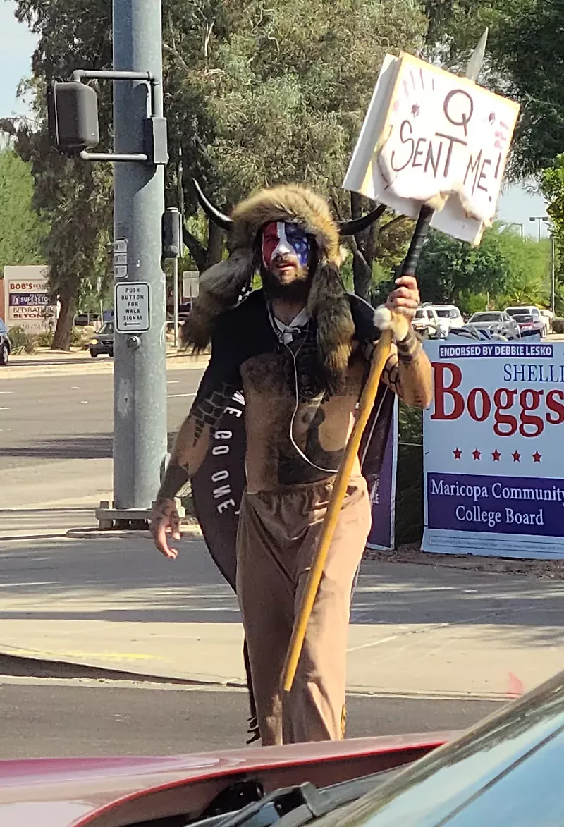 Image: Jake Angeli, otherwise known as the QAnon Shaman, protested in Peoria in October 2020 several months before storming the U.S. Capitol.