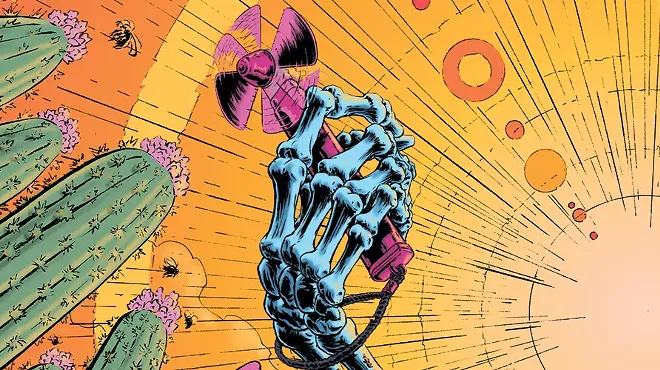 a skeleton hand holds a portable fan in the sun