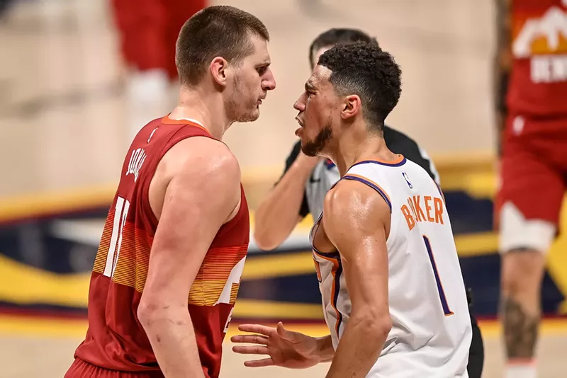 Image: Nikola Jokic of the Denver Nuggets and Devin Booker of the Phoenix Suns tangle in Game Four of the Western Conference second-round playoff series at Ball Arena in 2021.