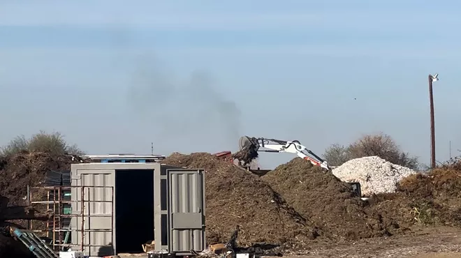 excavators and mounds of dirt
