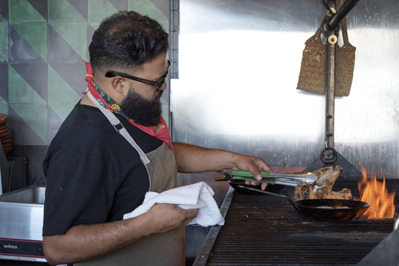 Chef Rene Andrade cooks over his wood-fired grill at Bacanora.