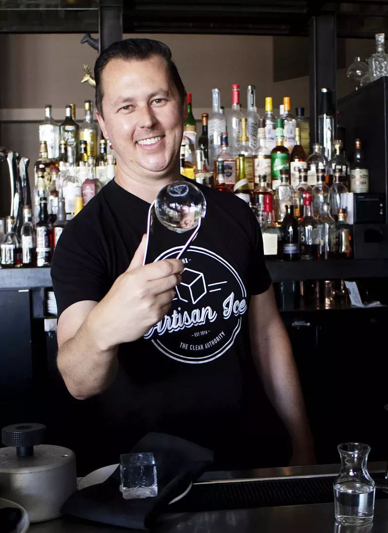 Image: Kurtis Williams shows off a large-format spherical ice ball.