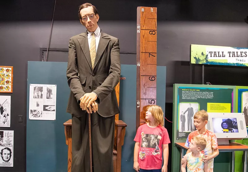Image: Patrons of Ripley’s Believe It or Not! in Scottsdale pose with a statue of Robert Wadlow, the world's tallest man.