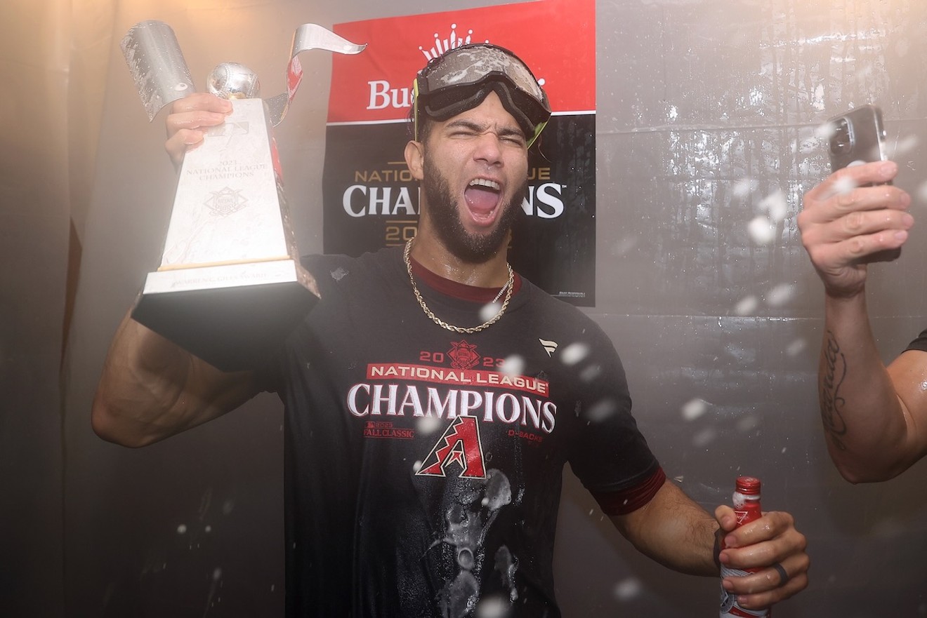Lourdes Gurriel Jr. celebrates in the clubhouse on Tuesday after the Arizona Diamondbacks won the National League Championship Series in Game 7.