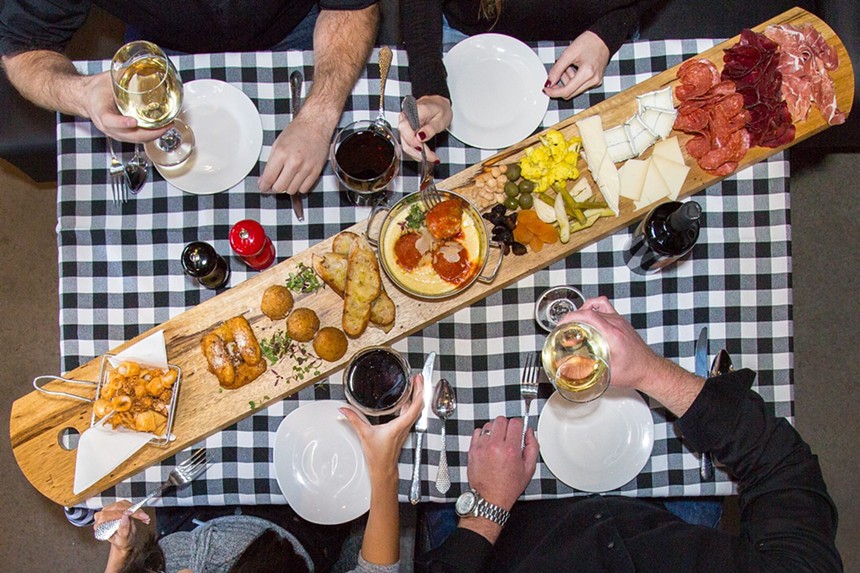 Charcuterie boards are meant for sharing during the game at The Sicilian Butcher. - MAGGIORE GROUP