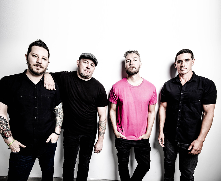 Authority Zero members, from left to right, Mike Spero (bass), Chris Dalley (drums), Jason DeVore and new guitarist, Eric Walsh. - AUTHORITY ZERO