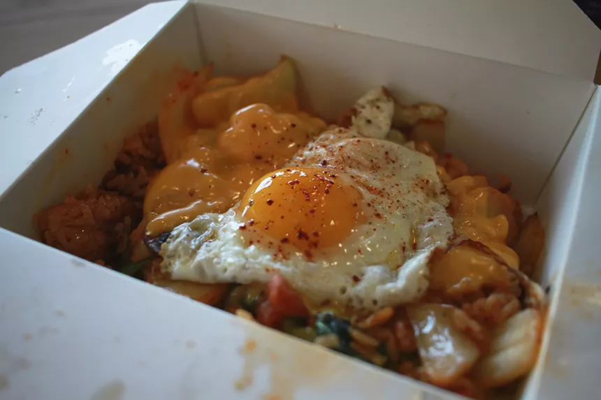 At Bap and Chicken, the house fried rice boasts vegetables and huge chunks of fried chicken, all topped with an over-easy egg. - ALLISON TREBACZ