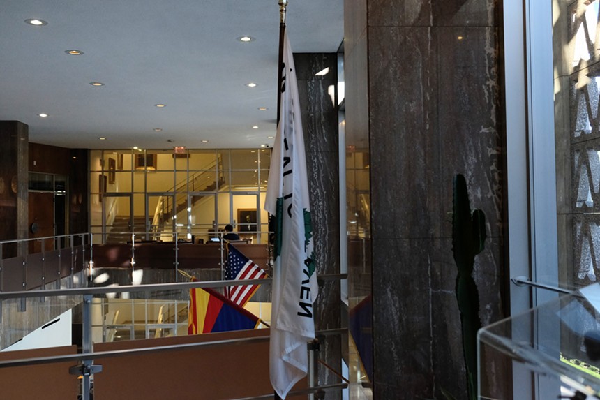The pine tree flag hanging in Arizona stands nearby the American flag and the Arizona state flag. - KATYA SCHWENK