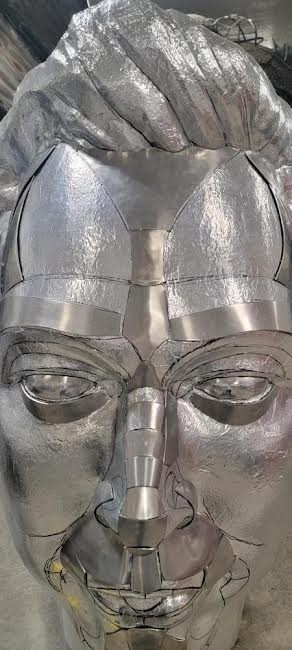 Elon head being wrapped in high heat aluminum - DANIELLE DORFMAN