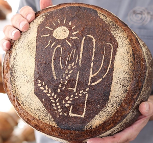 Barrio's lovely Locavore loaf showcases three organic local flours and a desert scene. - BARRIO BREAD
