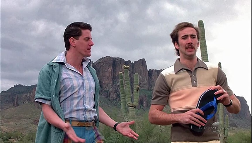 Sam McMurray as Glen (left) and Nicolas Cage as H.I. (right) with the Superstition Mountains in the background. - CIRCLE FILMS/20TH CENTURY FOX