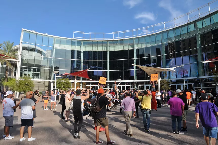 Suns fans are waiting outside the Footprint Center in downtown Phoenix. - BENJAMIN LEATHERMAN