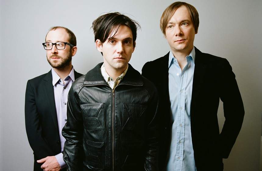 Mike Mogis (left), Conor Oberst (center), and Nate Walcott (right) of Bright Eyes. - PRESS HERE TALENT