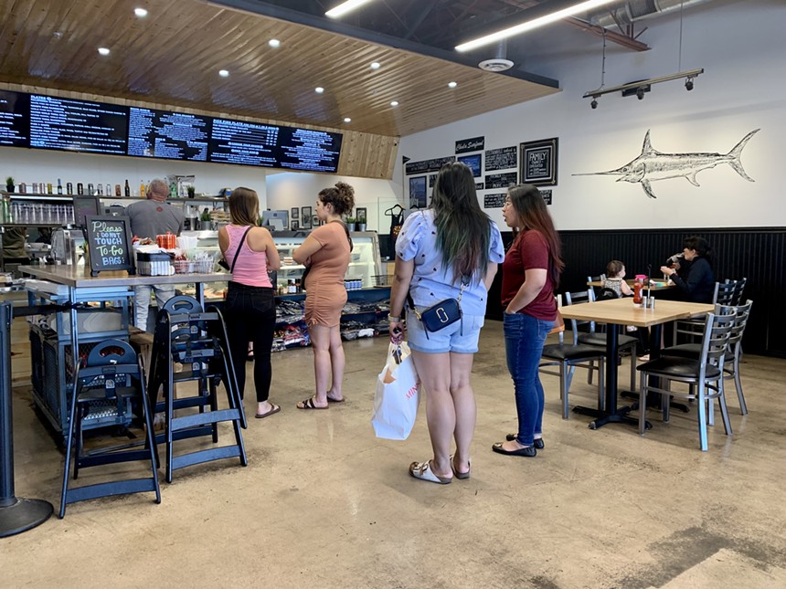 A line of customers waits to order lunch at Chula Seafood. - TIRION MORRIS