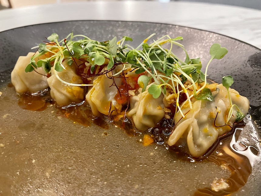 Seafood mandu are served with a soju and ginger broth and salmon roe. - TIRION MORRIS