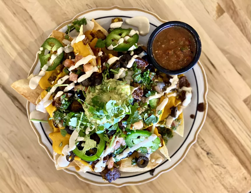 Melted cheese, crunchy fries, meaty vegan carne asada, guac, beans – Verdura's nachos have it all. - ALLISON YOUNG