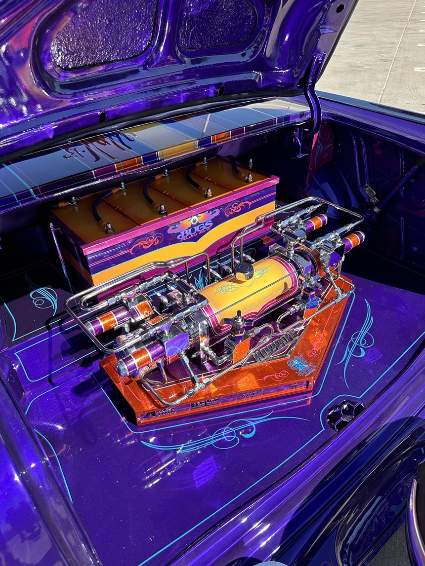 The colorful, intricate trunk of a custom lowrider car.