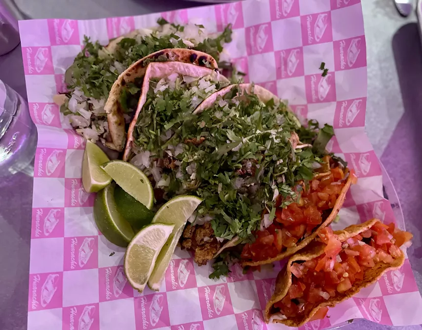 A platter of six tacos from Huarachis Taqueria.
