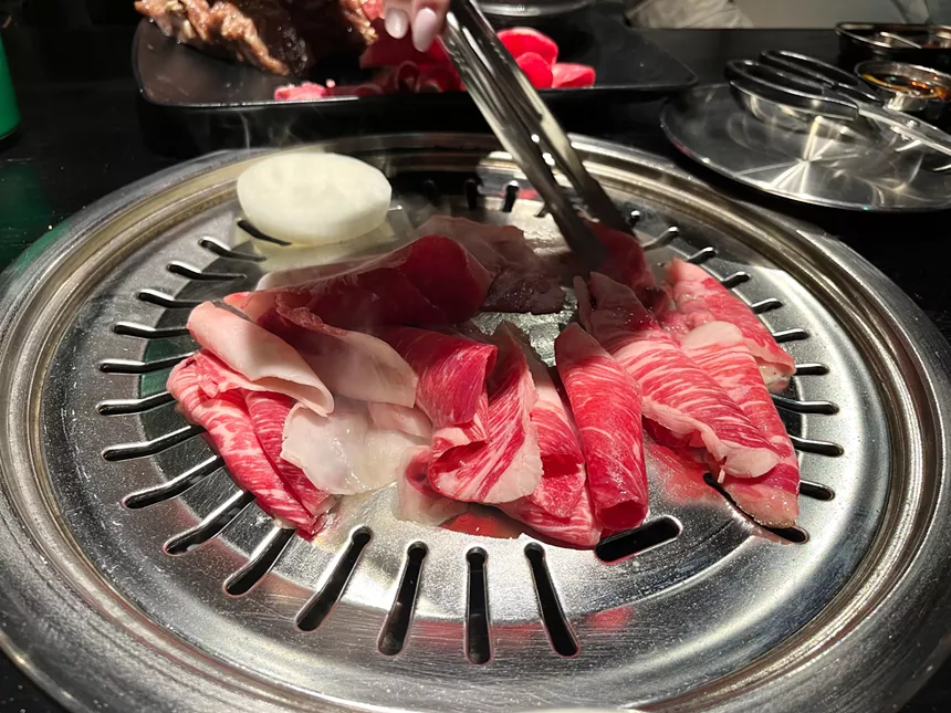 Meat on a grill at Smoking Tiger.