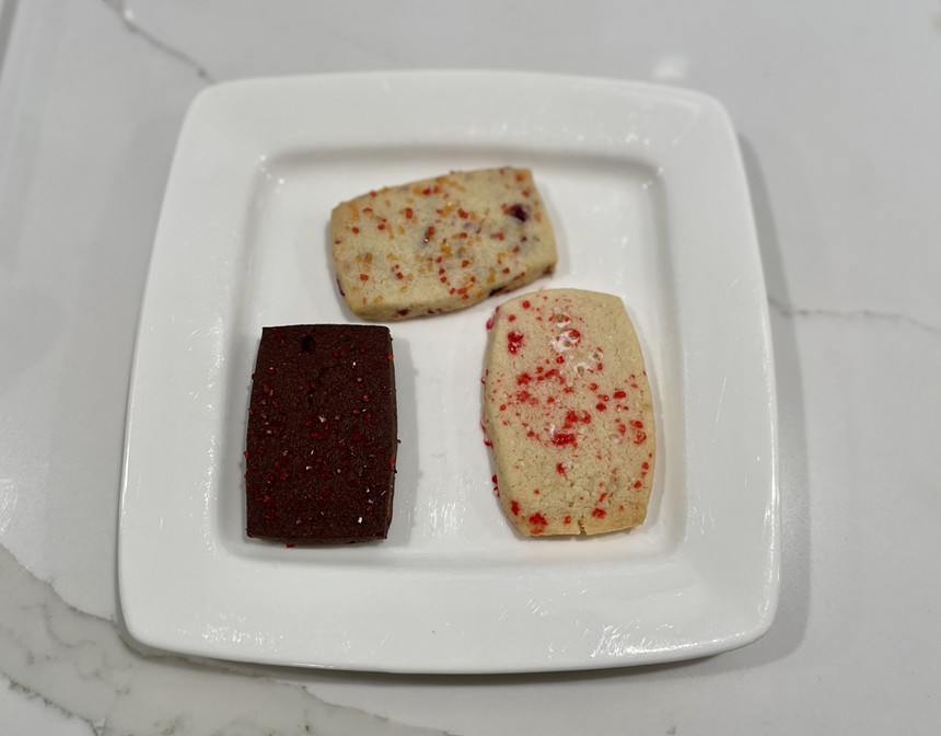 Three shortbread cookies on a plate.