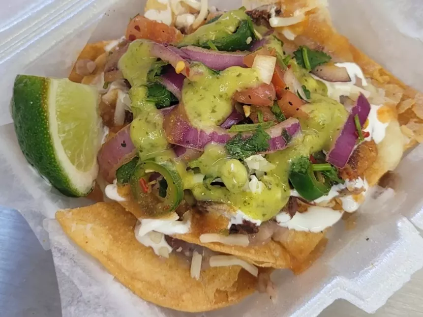 A plate of nachos with fresh salsa at MoLo's.