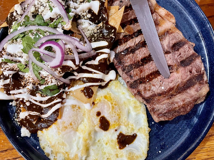 Steak and eggs plate with chilaquiles.