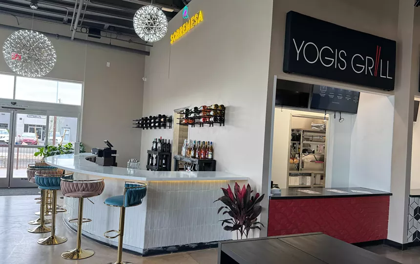 A wine bar next to a food hall kiosk.
